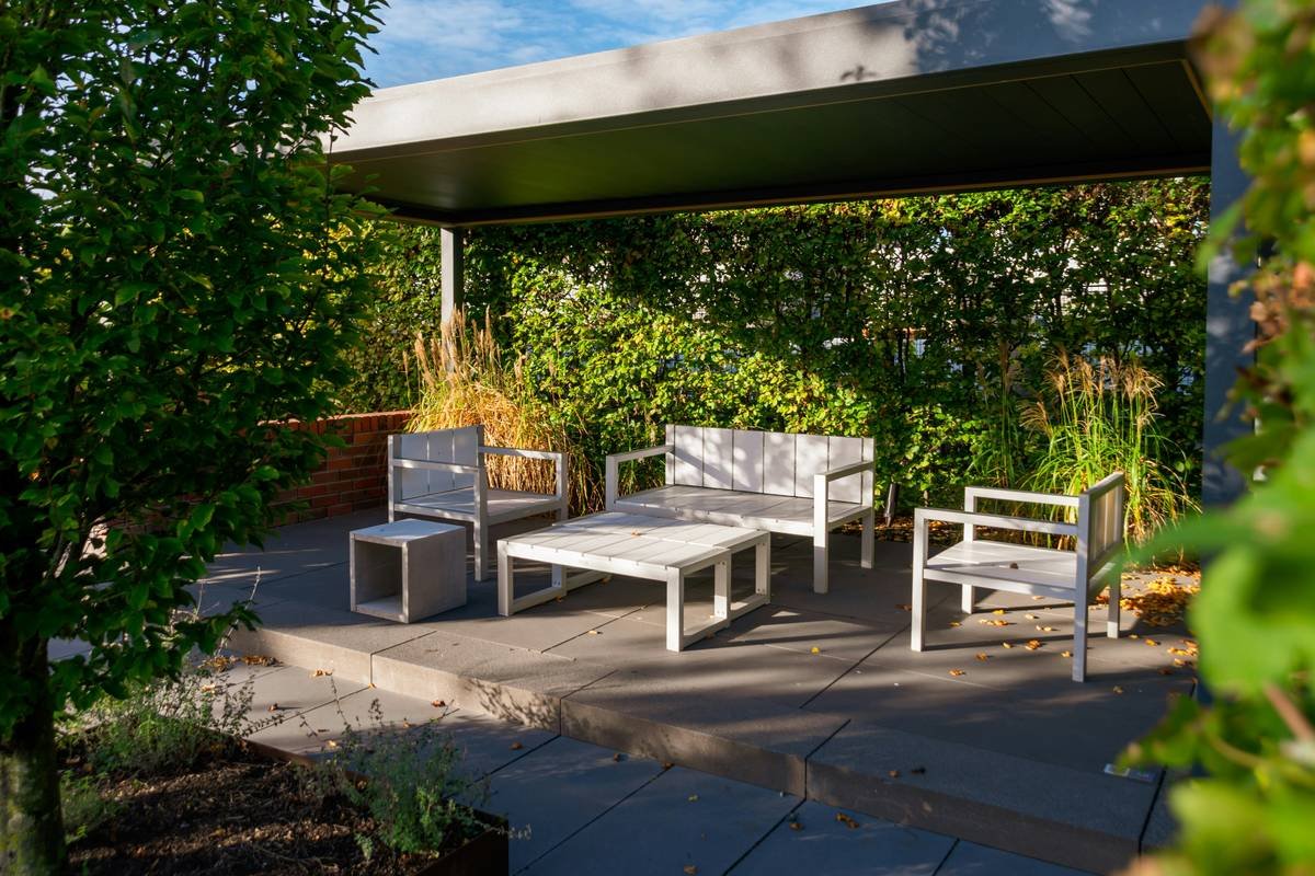 fire pit garden furniture arranged in a circular layout around a stone fire pit